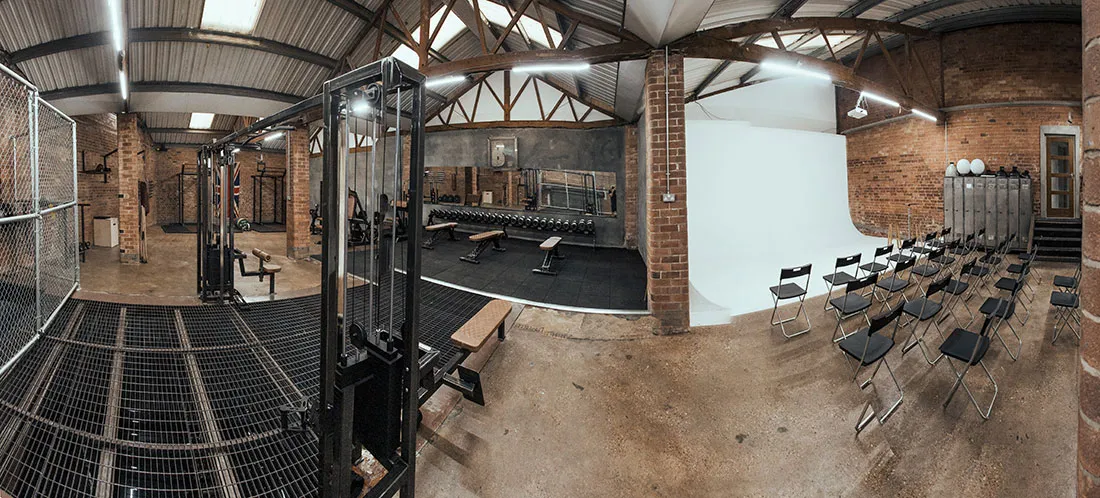 Bailey Studio panoramic view showing gym equipment and photography backdrop